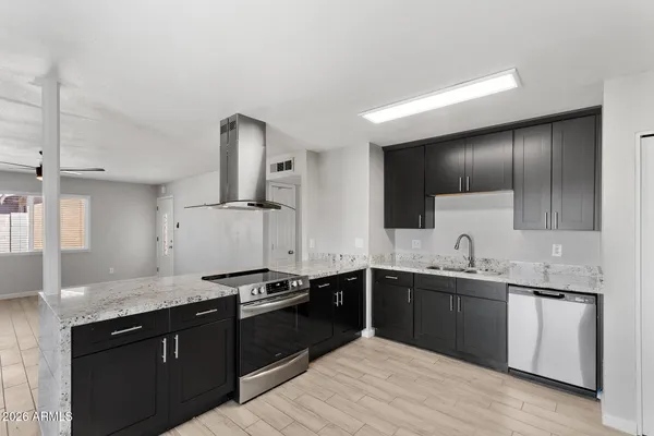 a kitchen with a sink and cabinets