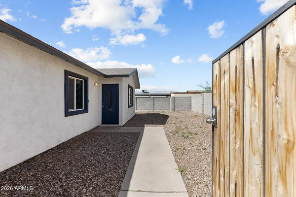 a house view with a backyard space
