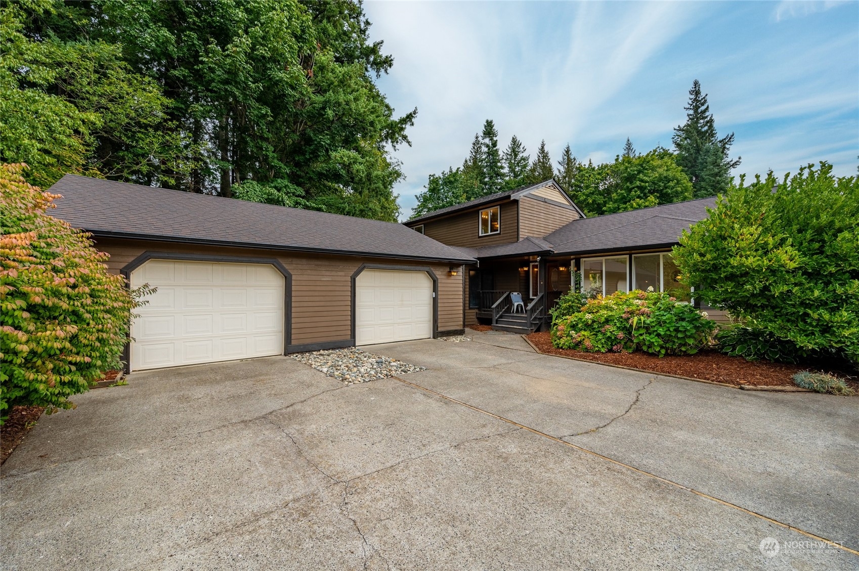 5730 Sand Road Bellingham, WA 98226 - Photo 3 of 40 a front view of a house with a yard and garage