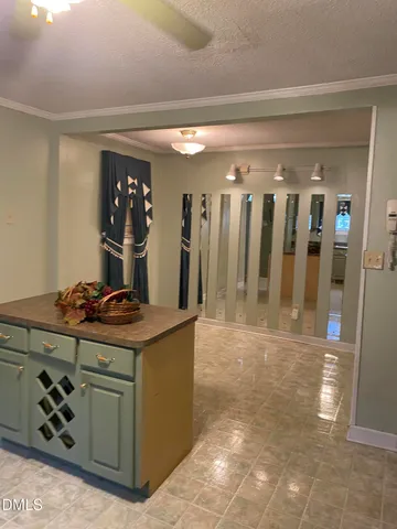 a kitchen with a stove and cabinets