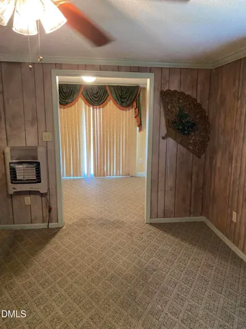 a view of an empty room with a fireplace