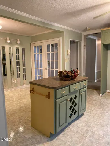 a kitchen with stainless steel appliances granite countertop a stove and a sink