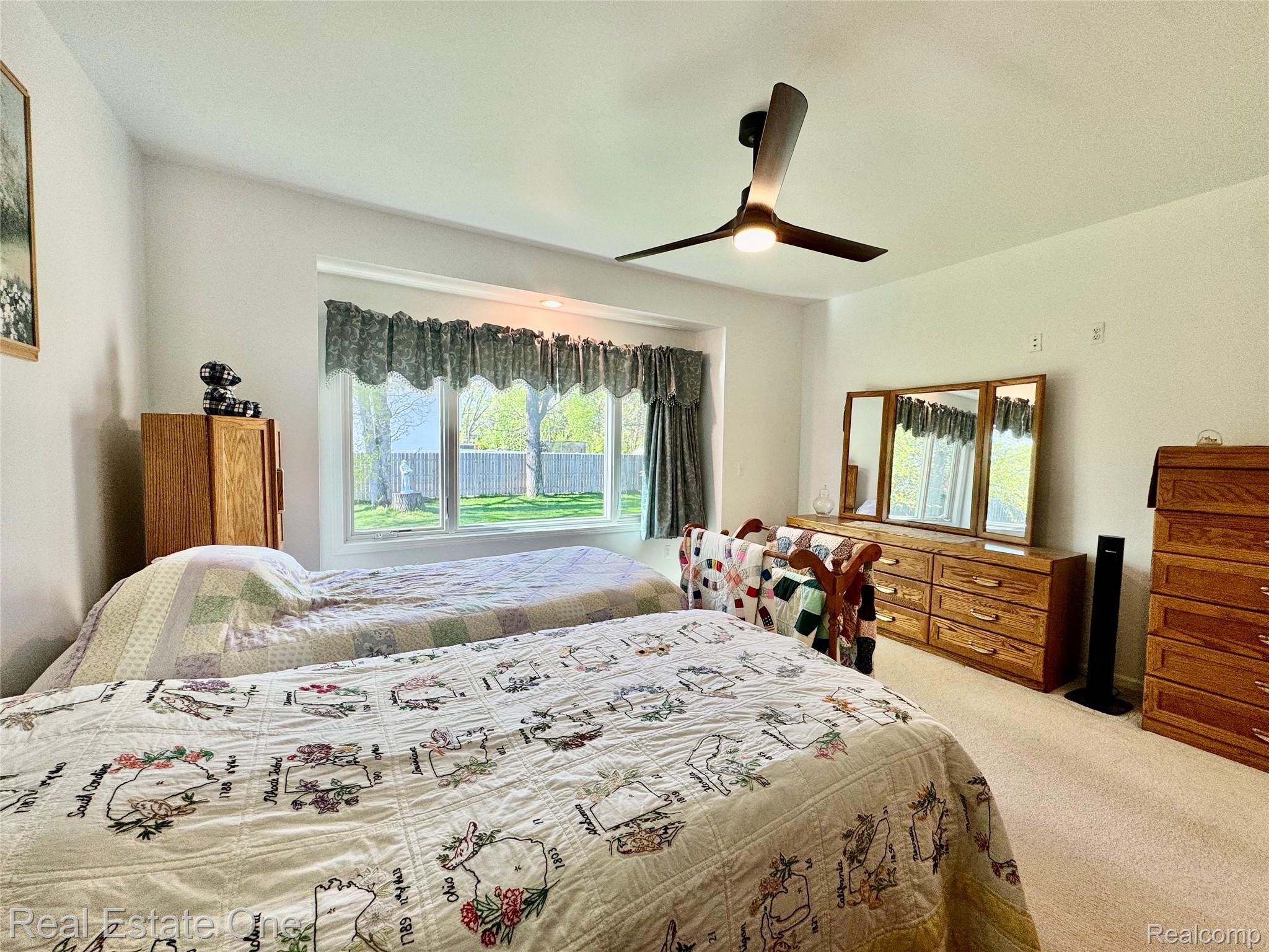 1668 South Shore Drive Rochester, MI 48307 - Photo 14 of 27 Bedroom featuring carpet and a ceiling fan