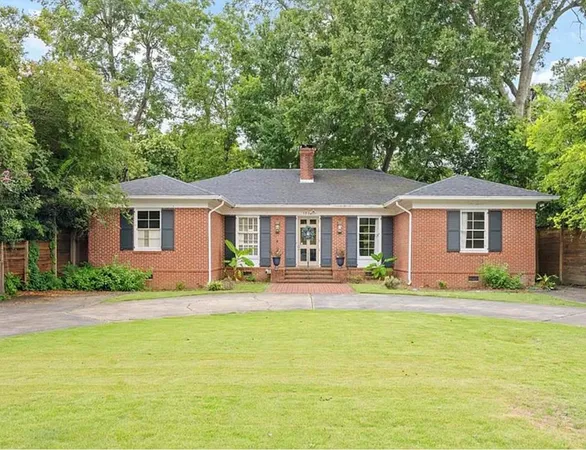 a front view of house with yard and seating area