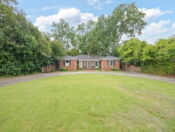 a house view with a garden space