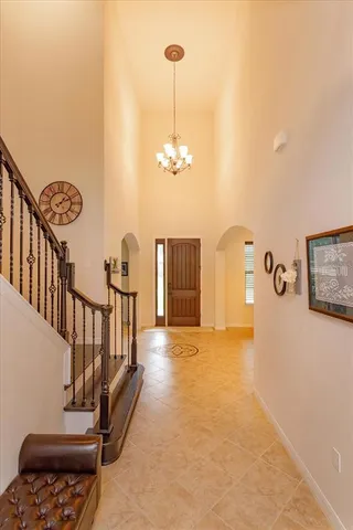 a view of a livingroom with furniture and staircase