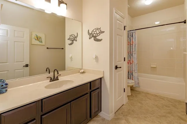 a bathroom with a sink double vanity shower and a bathtub