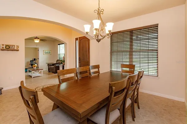 a dining room with furniture and window