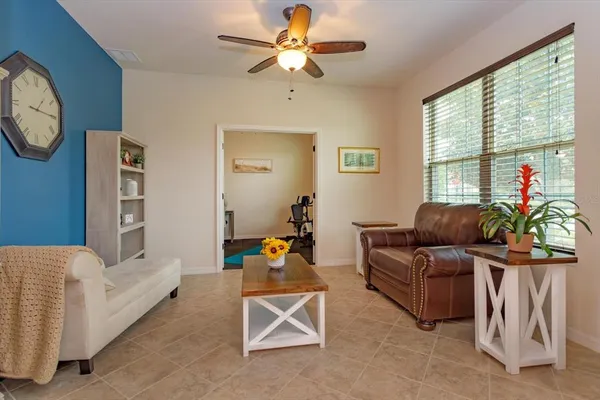 a living room with furniture and a large window