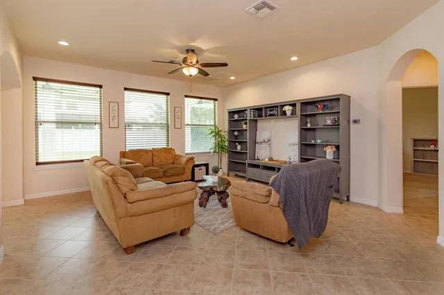 a living room with furniture and a window