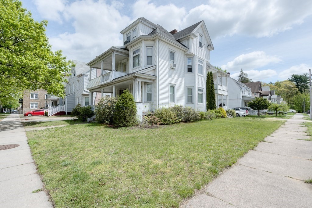 407-9 Sumner Avenue Springfield, MA 01108 - Photo 1 of 40 a front view of house with yard and green space