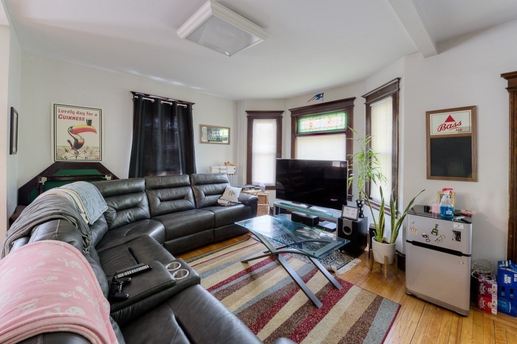407-9 Sumner Avenue Springfield, MA 01108 - Photo 18 of 40 a living room with furniture and a flat screen tv