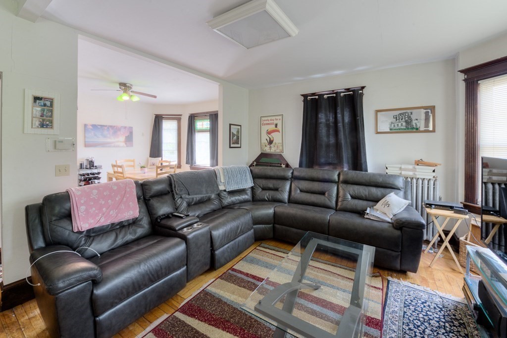 407-9 Sumner Avenue Springfield, MA 01108 - Photo 19 of 40 a living room with furniture and a rug