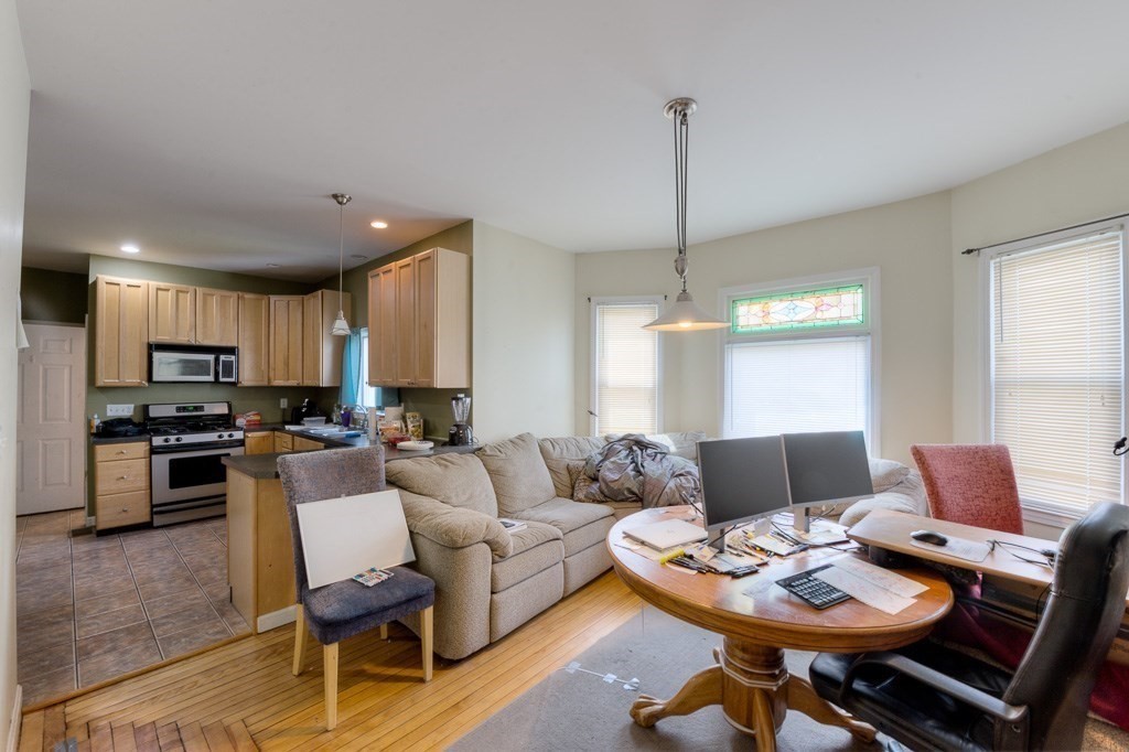 407-9 Sumner Avenue Springfield, MA 01108 - Photo 24 of 40 a living room with furniture and kitchen view