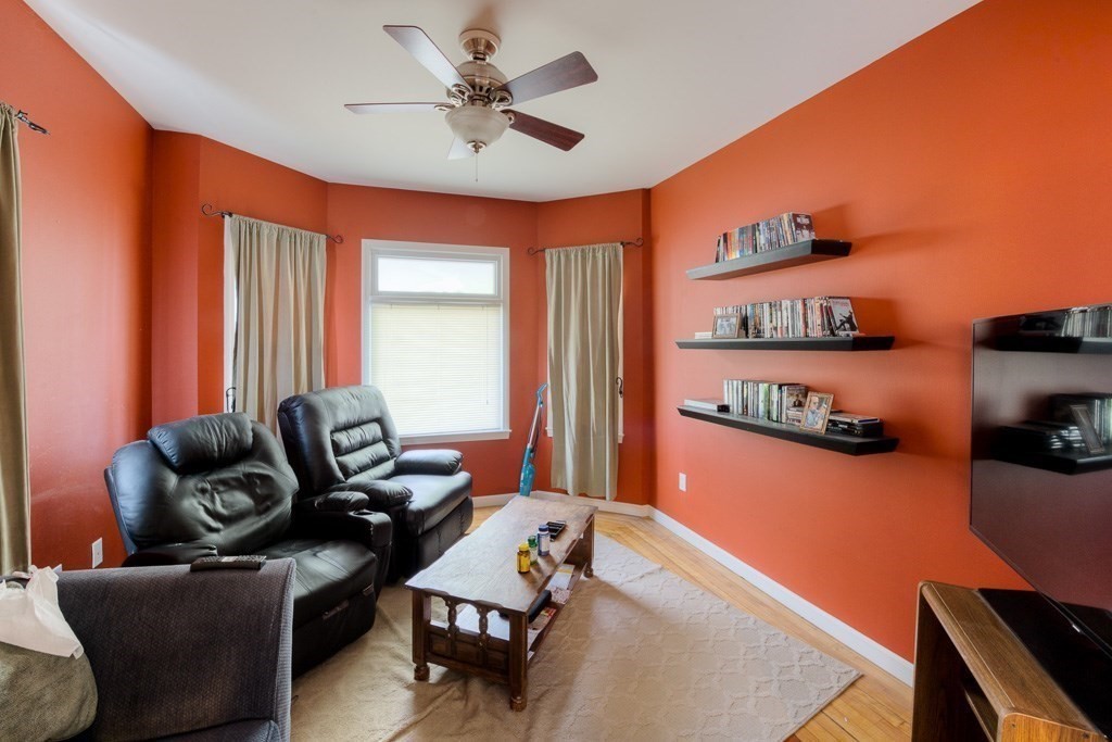 407-9 Sumner Avenue Springfield, MA 01108 - Photo 25 of 40 a living room with furniture and a flat screen tv