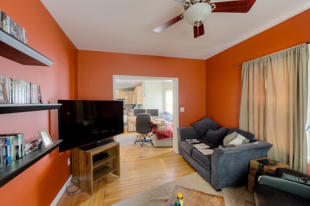 407-9 Sumner Avenue Springfield, MA 01108 - Photo 26 of 40 a living room with furniture and a flat screen tv