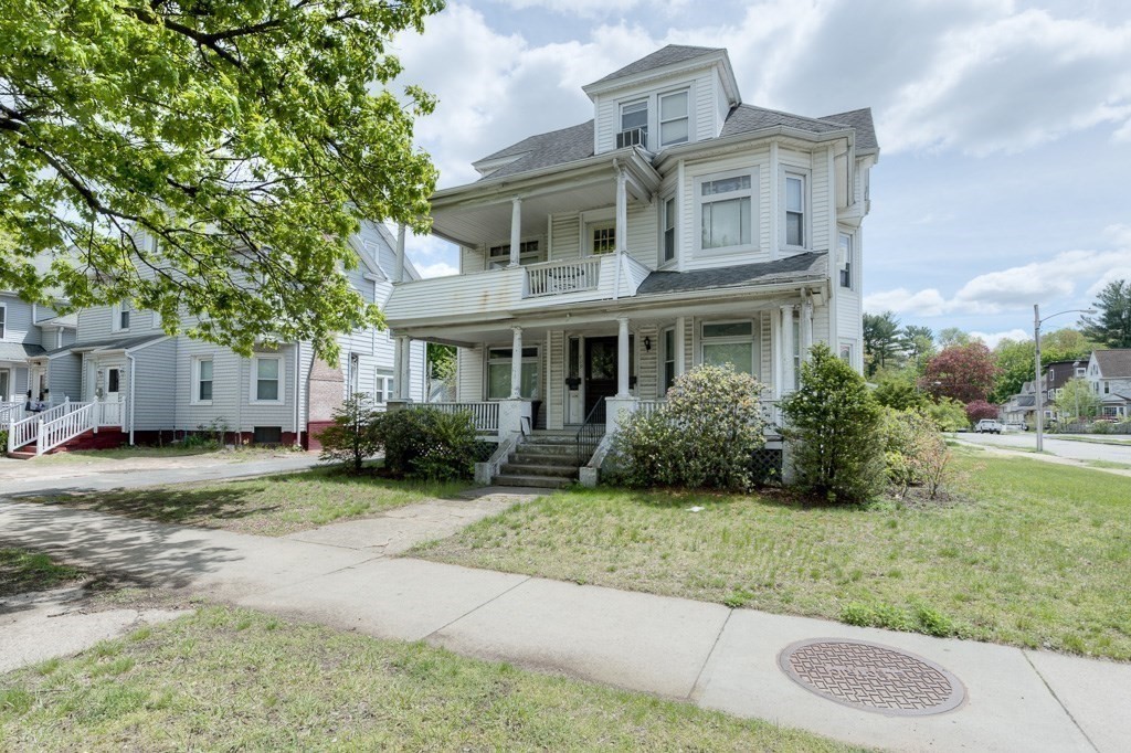 407-9 Sumner Avenue Springfield, MA 01108 - Photo 3 of 40 front view of a house with a yard