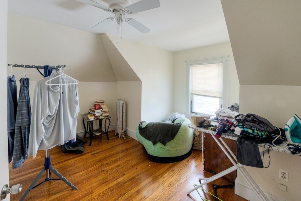 407-9 Sumner Avenue Springfield, MA 01108 - Photo 34 of 40 a room with gym equipment and wooden floor