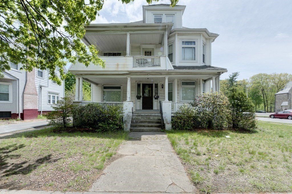 407-9 Sumner Avenue Springfield, MA 01108 - Photo 4 of 40 a front view of a house with garden