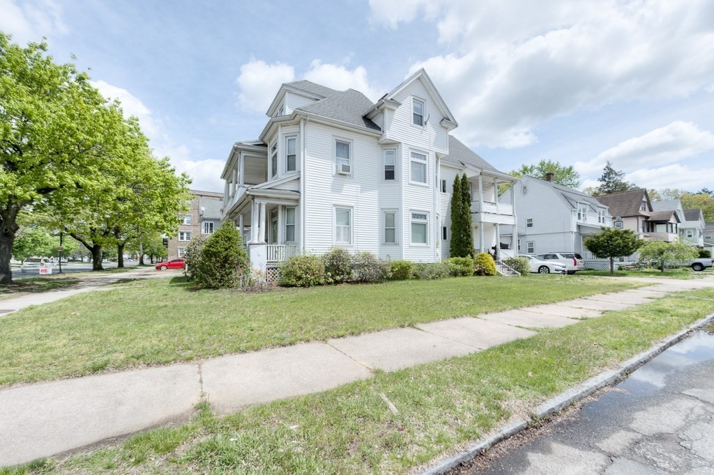 407-9 Sumner Avenue Springfield, MA 01108 - Photo 5 of 40 front view of a house with a yard