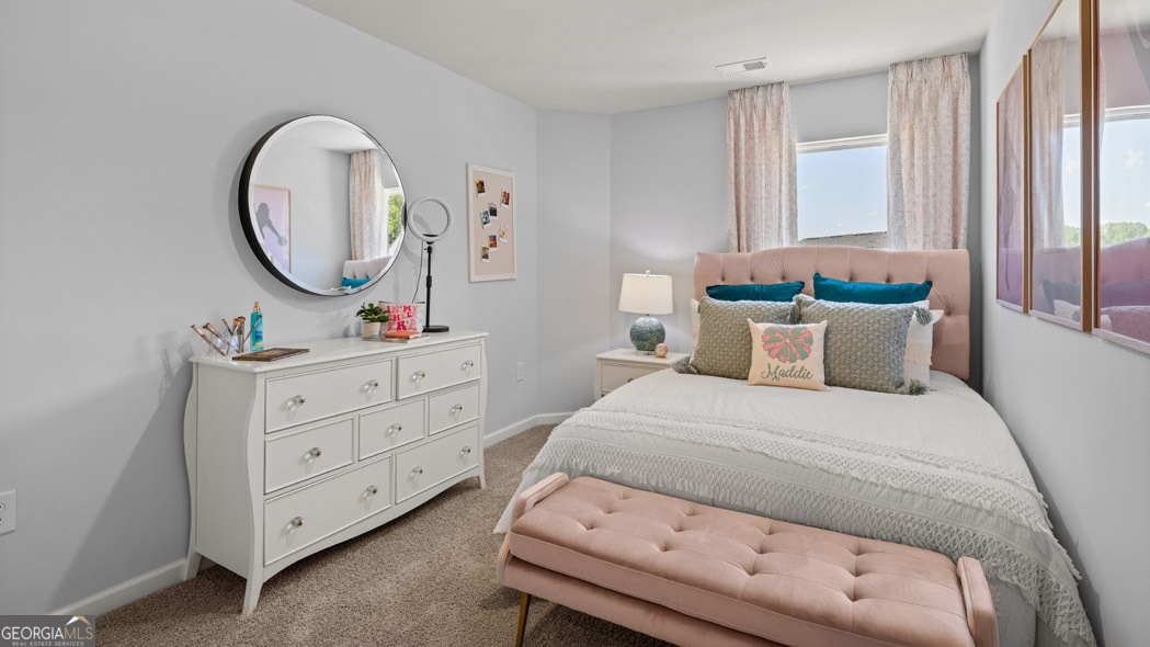 404 Reflection Drive Stockbridge, GA 30281 - Photo 51 of 57 a bedroom with a bed and a dresser