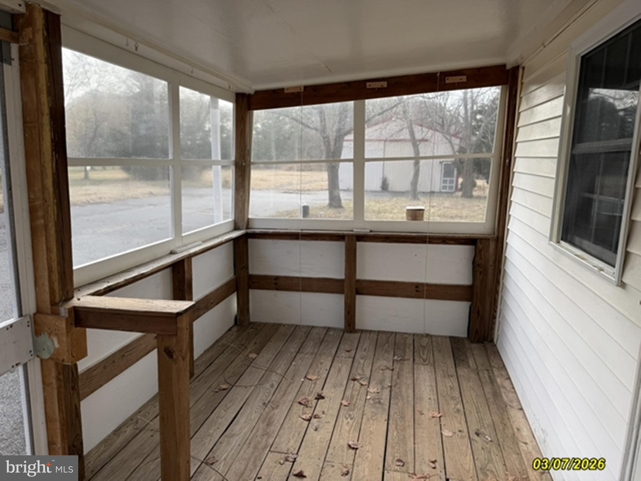 8784 Cummings Road Wittman, MD 21676 - Photo 10 of 27 screened side porch