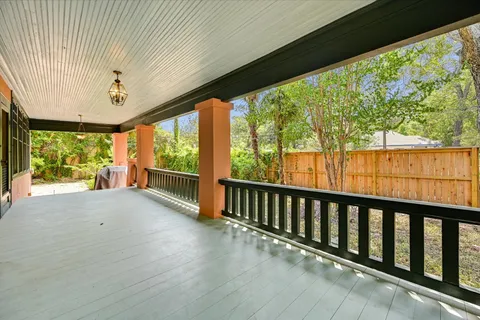 a view of a porch with wooden floor and outdoor space