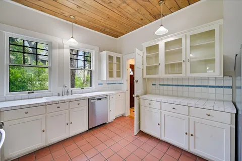 a kitchen with sink and window
