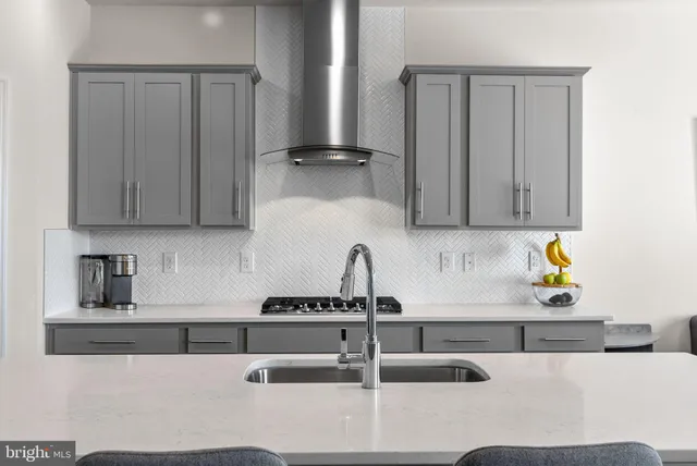 a view of kitchen with cabinets table and chairs