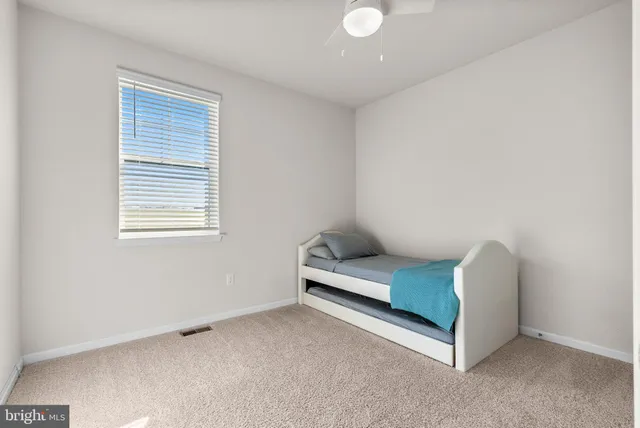 a bedroom with furniture and window