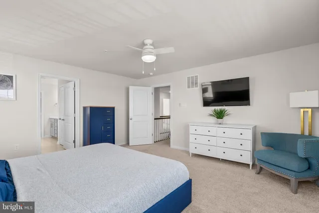 a view of walk in closet with clothes
