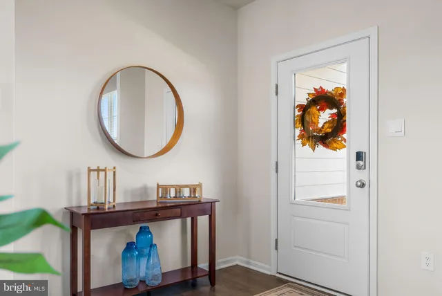 a view of a room with wooden floor and closet