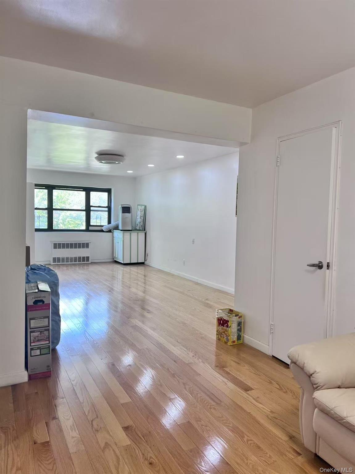 138-20 31st Road, Unit 2C Queens, NY 11354 - Photo 3 of 6 a view of empty room with wooden floor