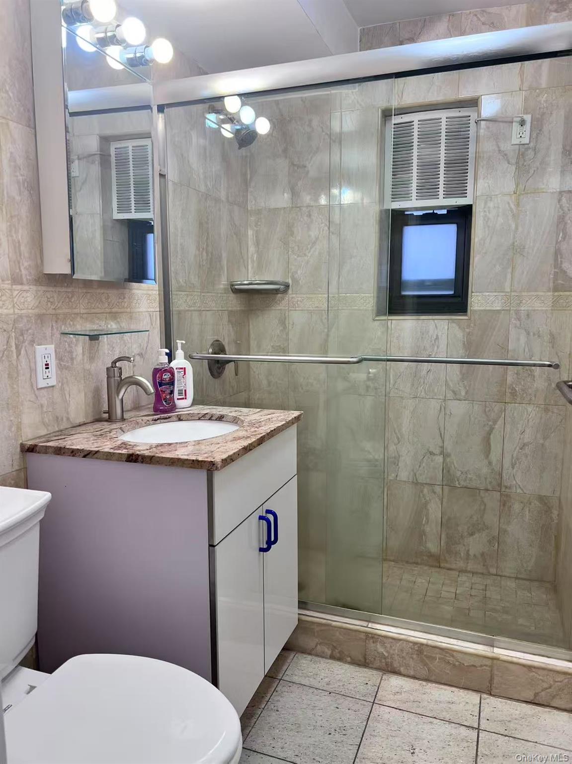 138-20 31st Road, Unit 2C Queens, NY 11354 - Photo 6 of 6 a bathroom with a sink toilet and shower