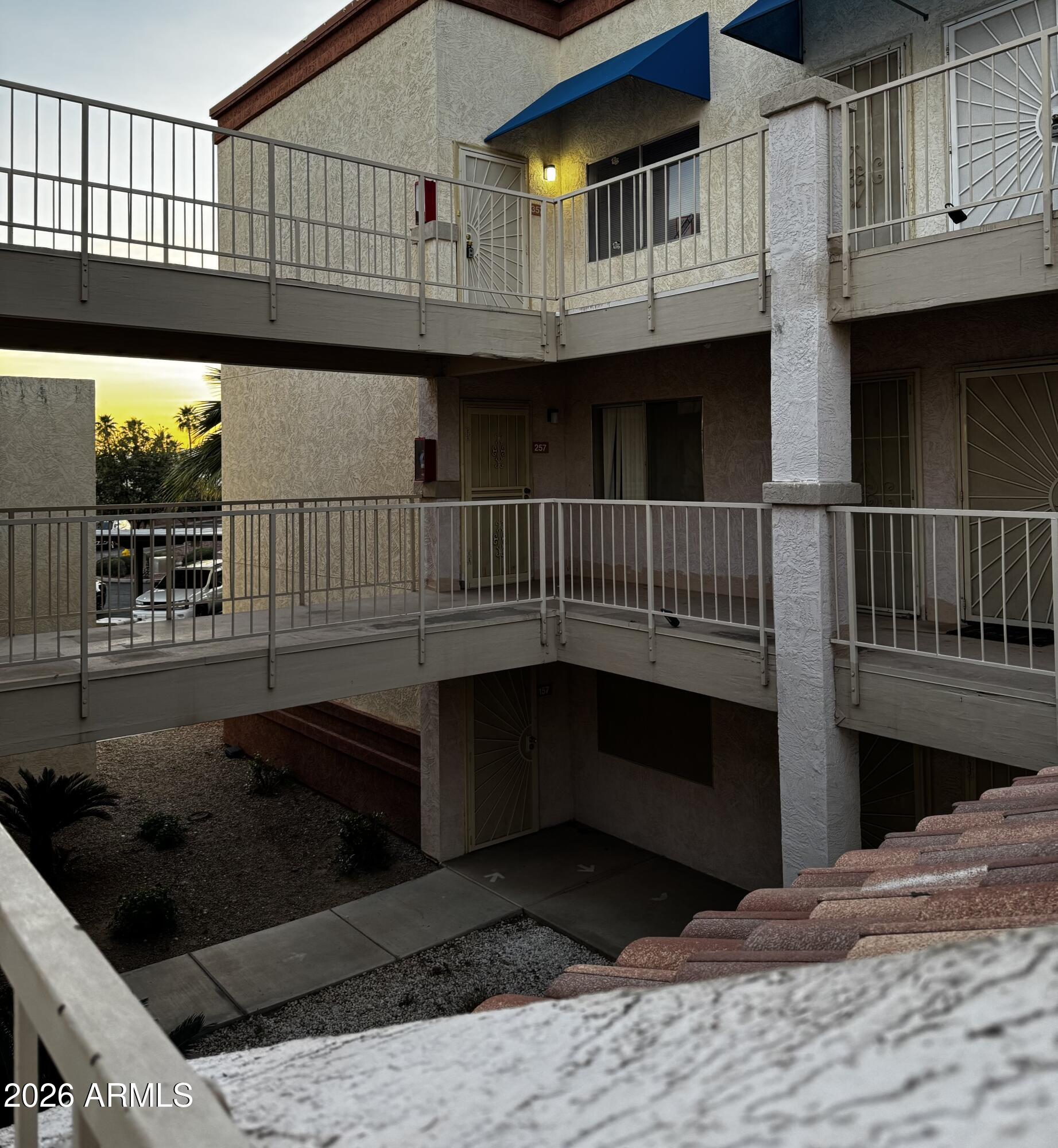12123 West Bell Road, Unit 258 Surprise, AZ 85378 - Photo 23 of 30 a view of a house with a wooden deck