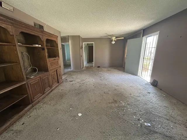 a view of empty room with windows