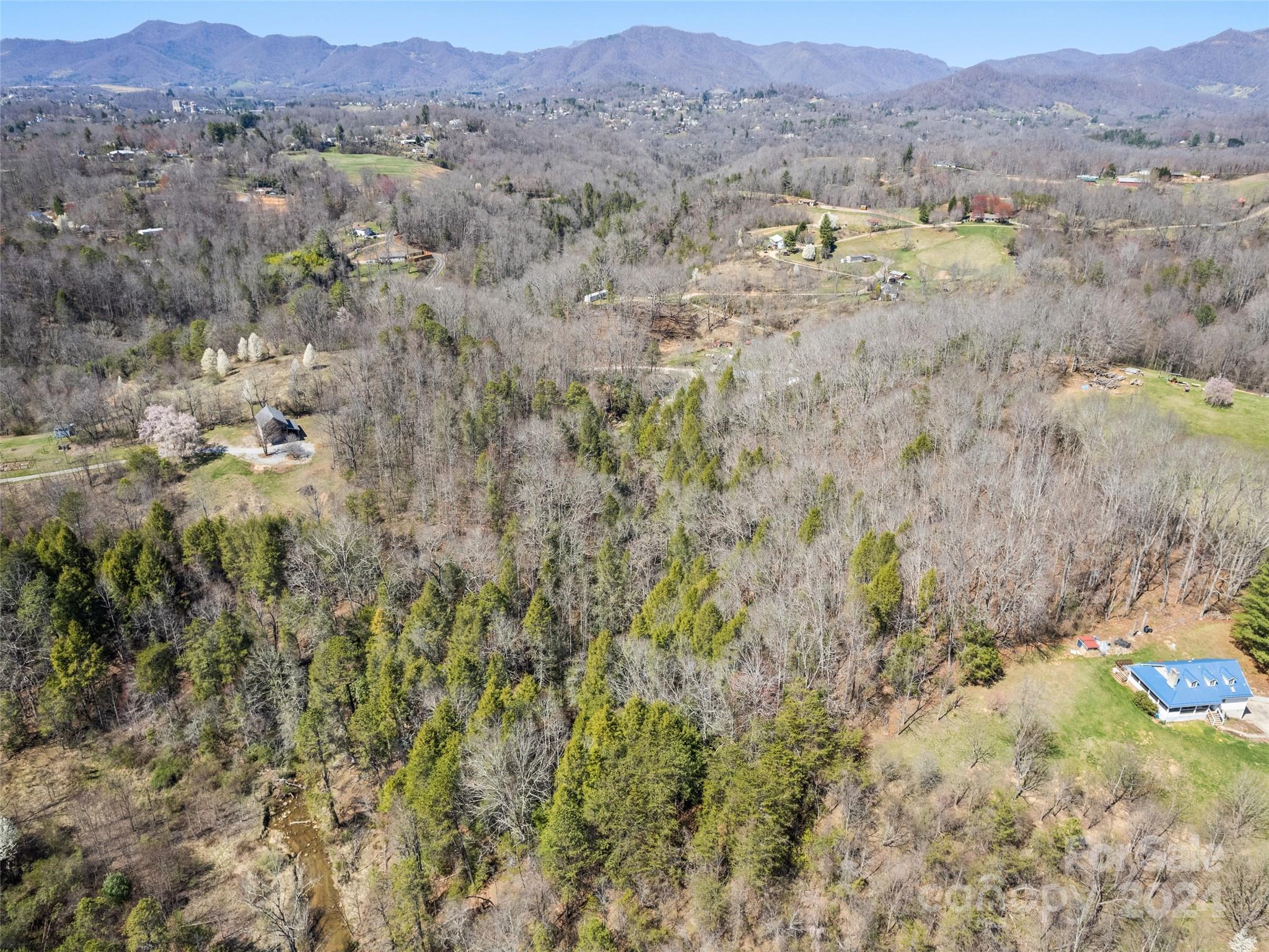 0 Dublin Ridge, Unit 3 Canton, NC 28716 - Photo 8 of 10 a view of a lush green hillside and houses