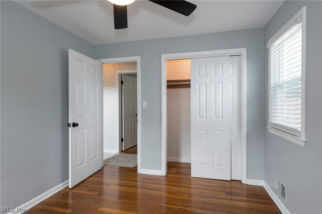 13175 McCracken Road Cleveland, OH 44125 - Photo 22 of 48 Beddroom featuring a closet, dark hardwood / wood-style floors, and ceiling fan