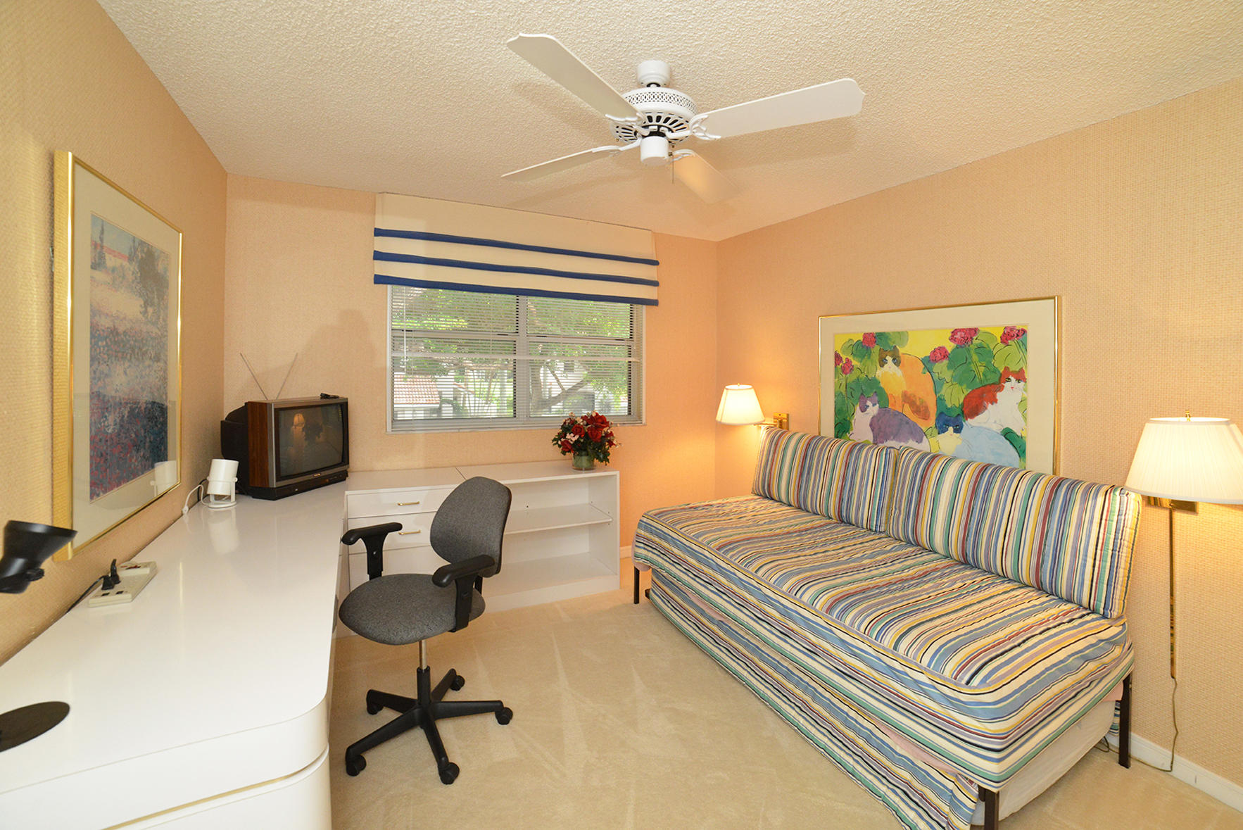 2168 Northwest 53rd Street Boca Raton, FL 33496 - Photo 18 of 31 a bedroom with furniture and a window