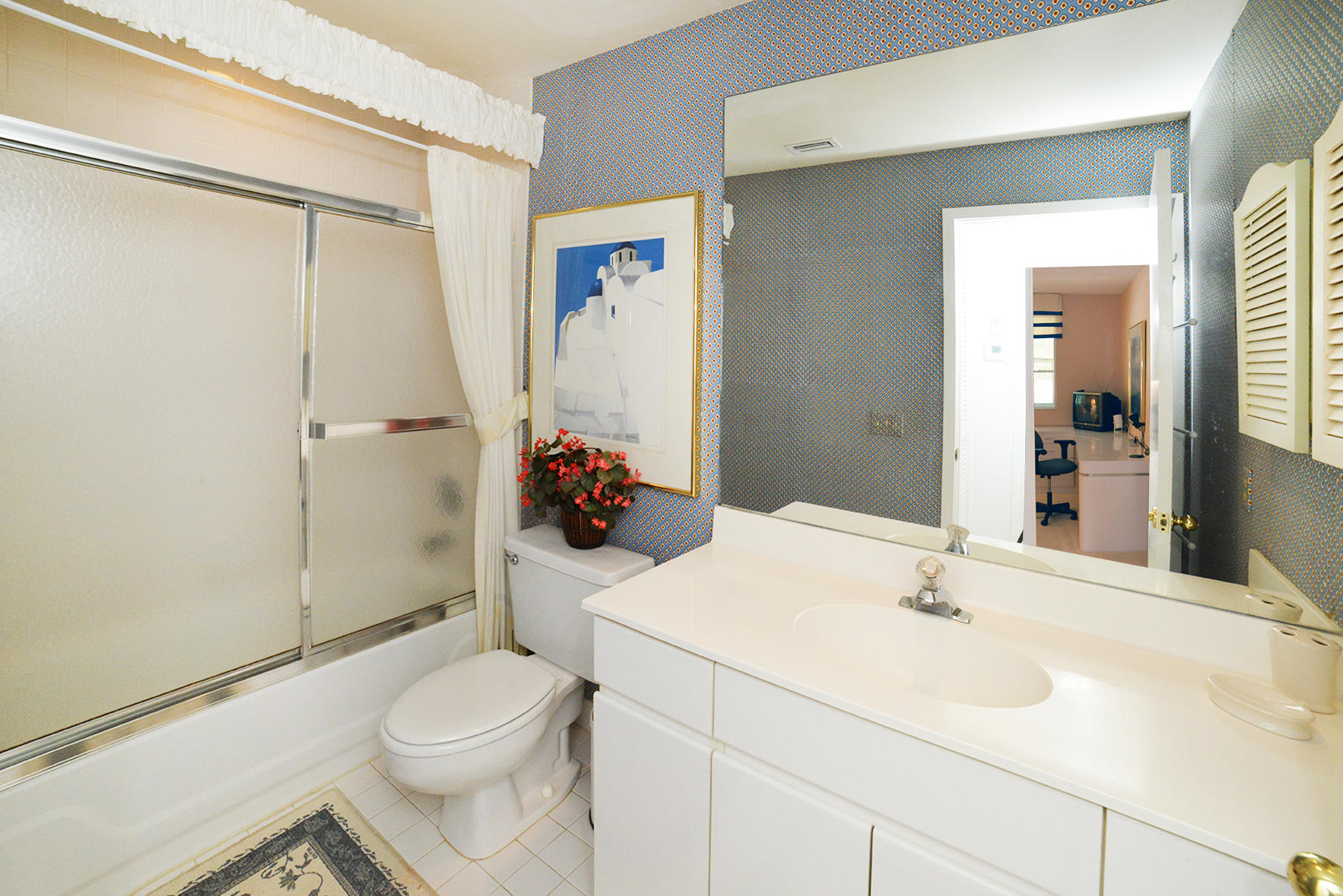 2168 Northwest 53rd Street Boca Raton, FL 33496 - Photo 19 of 31 a bathroom with a sink toilet and shower