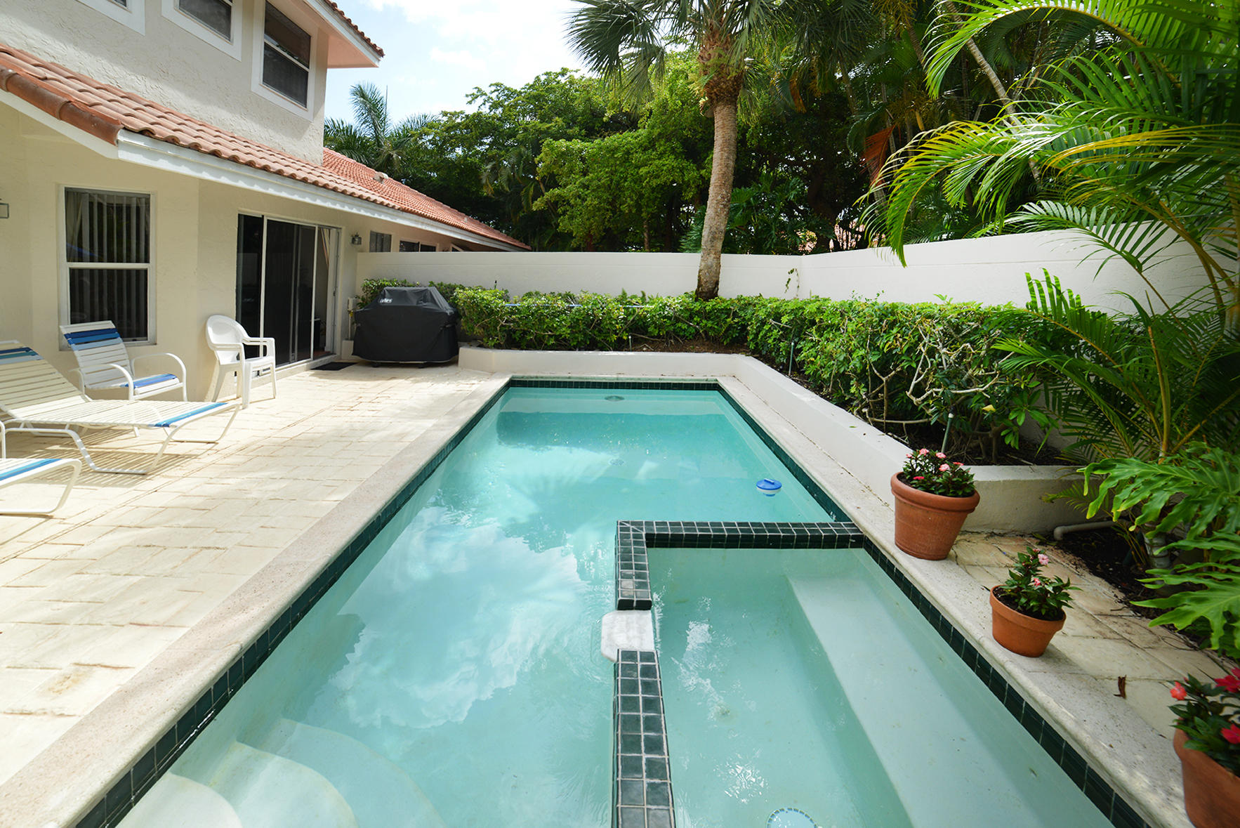 2168 Northwest 53rd Street Boca Raton, FL 33496 - Photo 27 of 31 a view of swimming pool with a patio