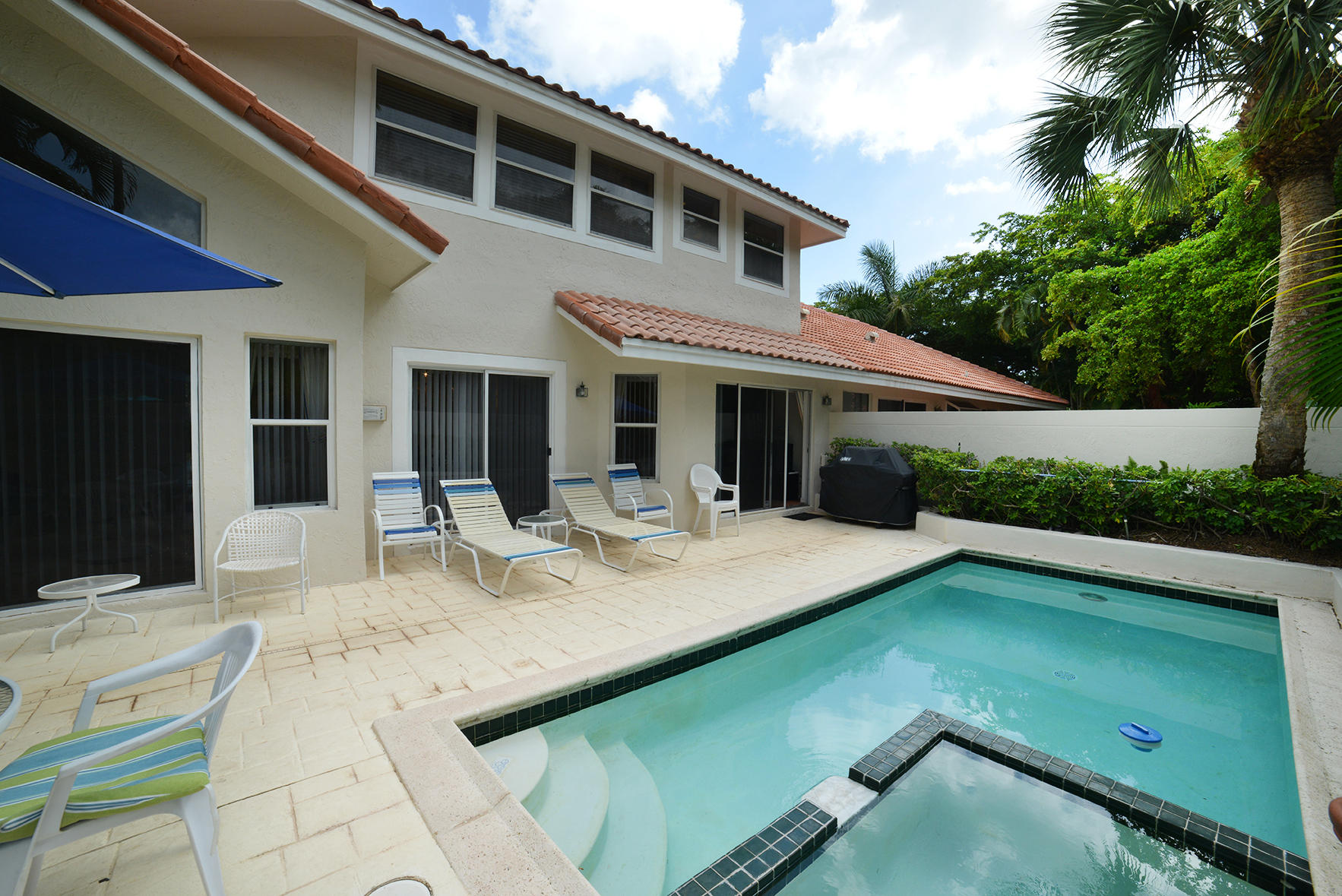 2168 Northwest 53rd Street Boca Raton, FL 33496 - Photo 28 of 31 a view of a patio with swimming pool table and chairs