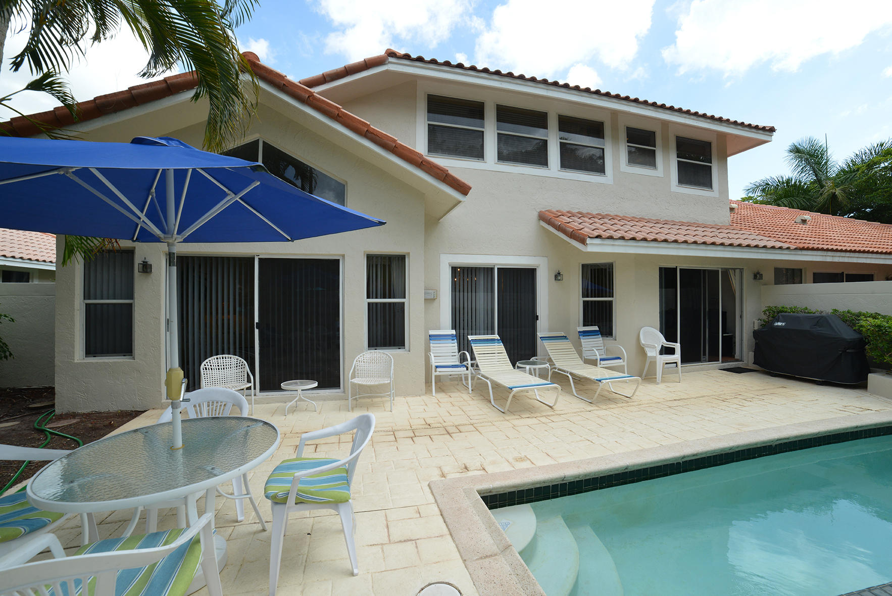 2168 Northwest 53rd Street Boca Raton, FL 33496 - Photo 29 of 31 a house view with a sitting space and garden space