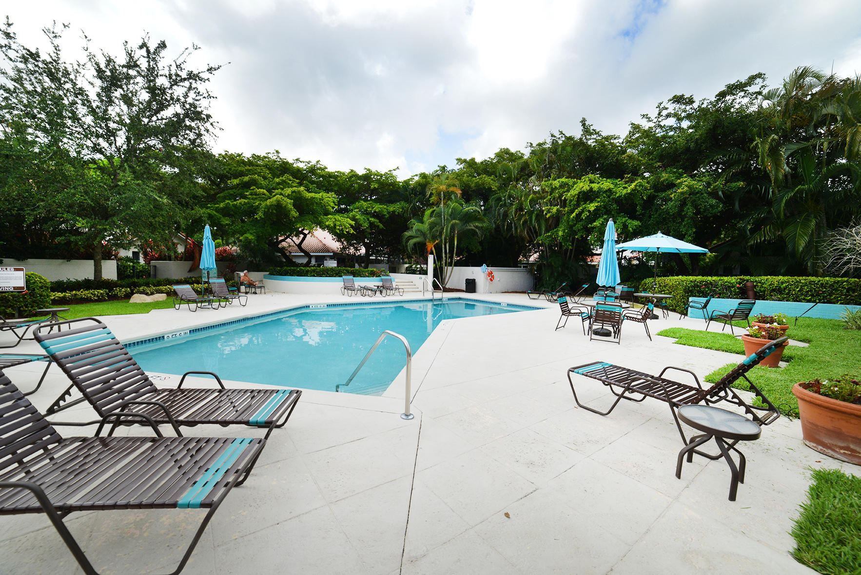 2168 Northwest 53rd Street Boca Raton, FL 33496 - Photo 31 of 31 a view of a swimming pool with lounge chairs in patio