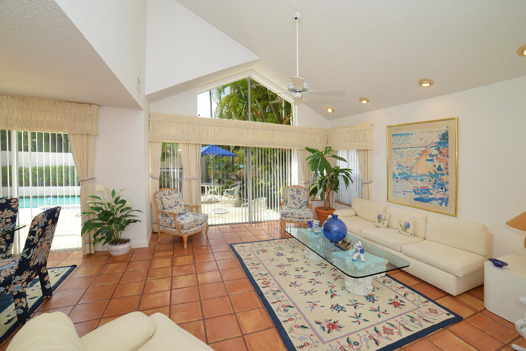 2168 Northwest 53rd Street Boca Raton, FL 33496 - Photo 4 of 31 a living room with furniture and a floor to ceiling window