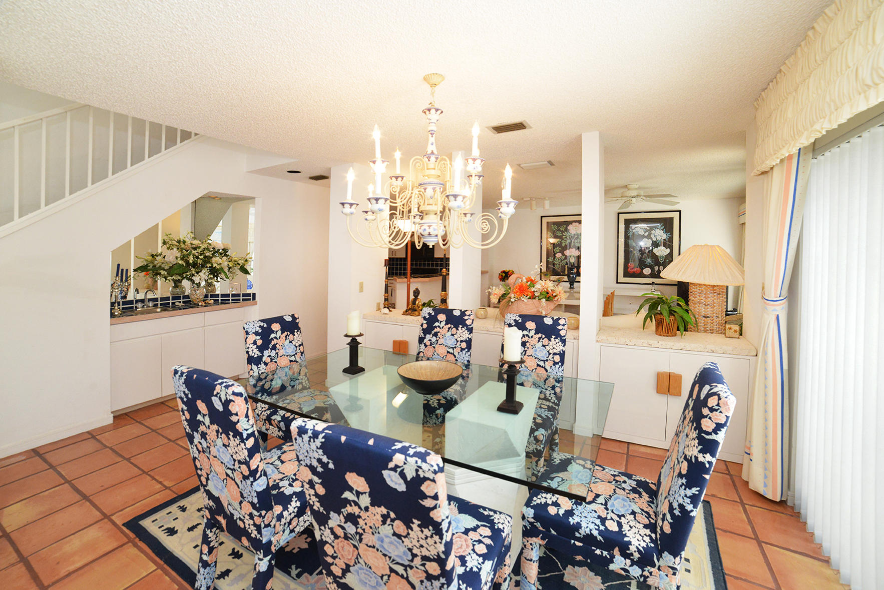 2168 Northwest 53rd Street Boca Raton, FL 33496 - Photo 7 of 31 a view of a dining room with furniture and a chandelier