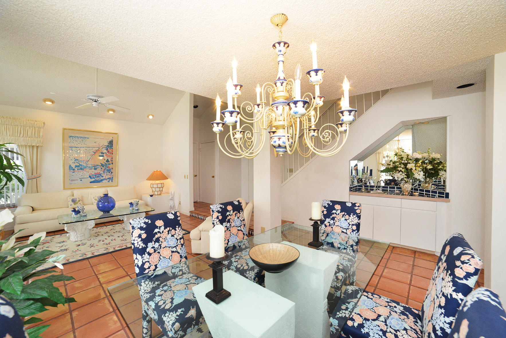2168 Northwest 53rd Street Boca Raton, FL 33496 - Photo 9 of 31 a view of a dining room with furniture and chandelier