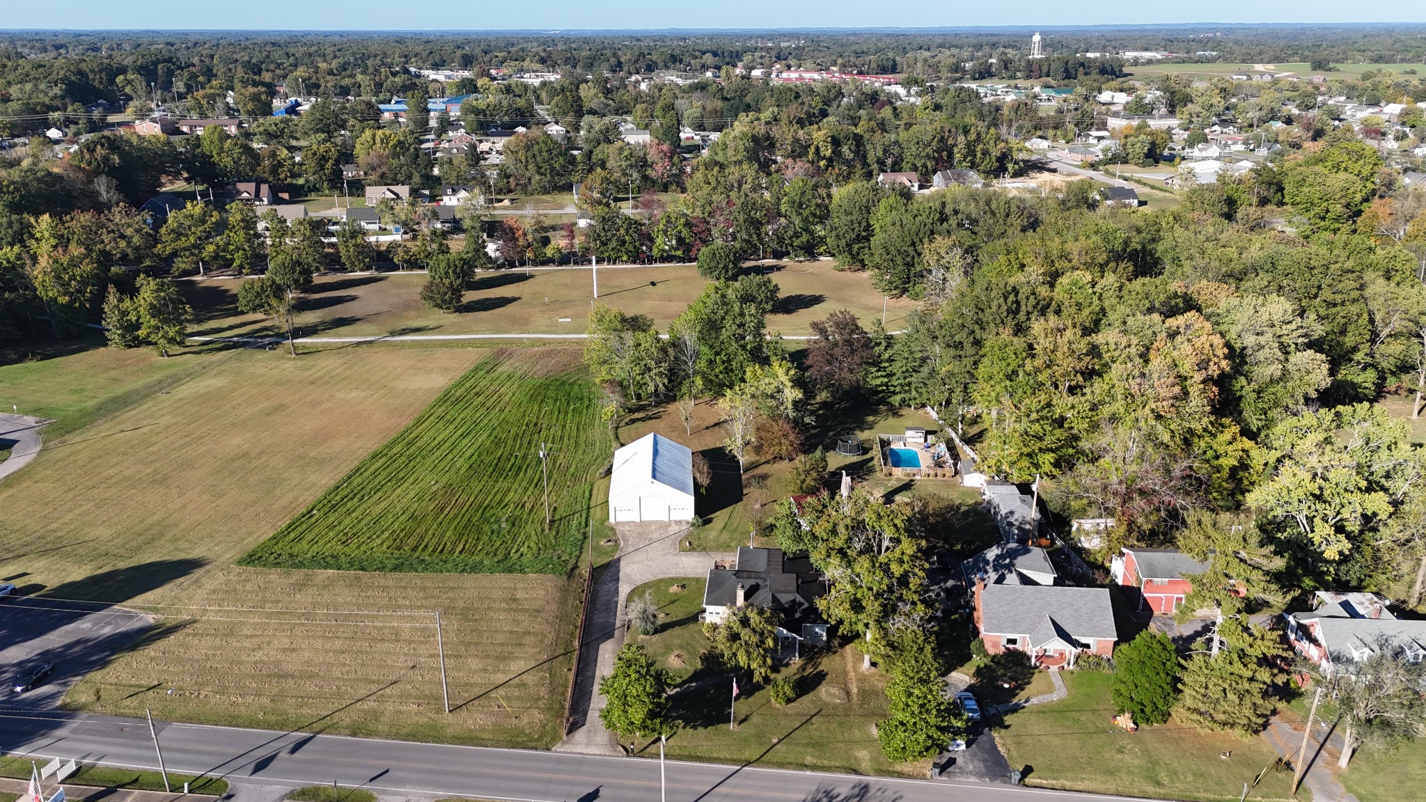 304 Church Street Lafayette, TN 37083 - Photo 3 of 9 an aerial view of residential houses with outdoor space