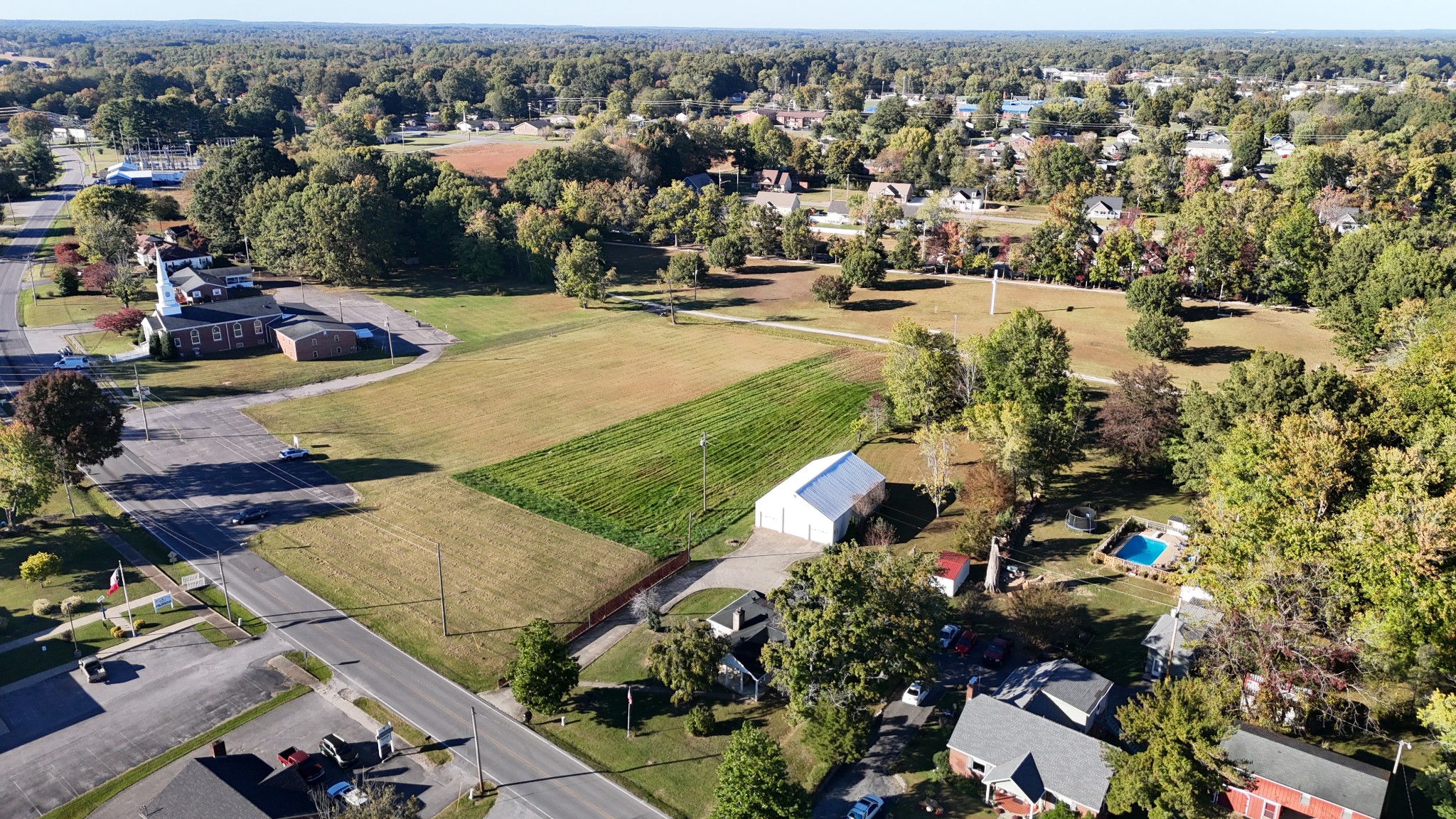 304 Church Street Lafayette, TN 37083 - Photo 4 of 9 an aerial view of residential houses with outdoor space