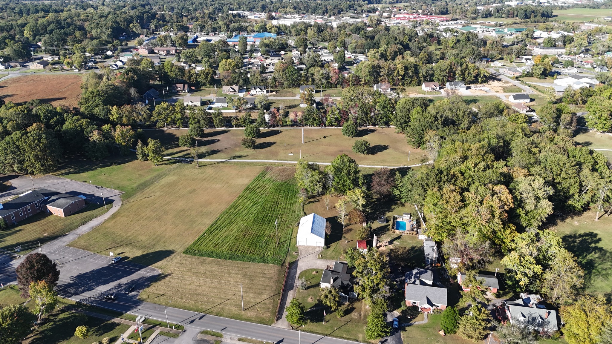 304 Church Street Lafayette, TN 37083 - Photo 5 of 9 an aerial view of residential houses with outdoor space